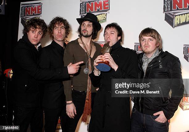 Kasabian pose with the award for Best Live Band in the awards room at the Shockwaves NME awards, at the Hammersmith Palais on March 1, 2007 in...