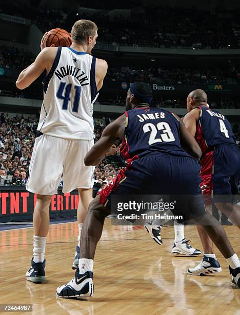 Dirk Nowitzki of the Dallas Mavericks backs down LeBron James of the Cleveland Cavaliers on March 1, 2007 at the American Airlines Center in Dallas,...
