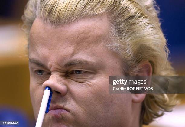 The Hague, NETHERLANDS: Dutch Geert Wilders, leader of the parliamentary party Partij voor de Vrijheid, PVV picks his nose during a parliamentary...