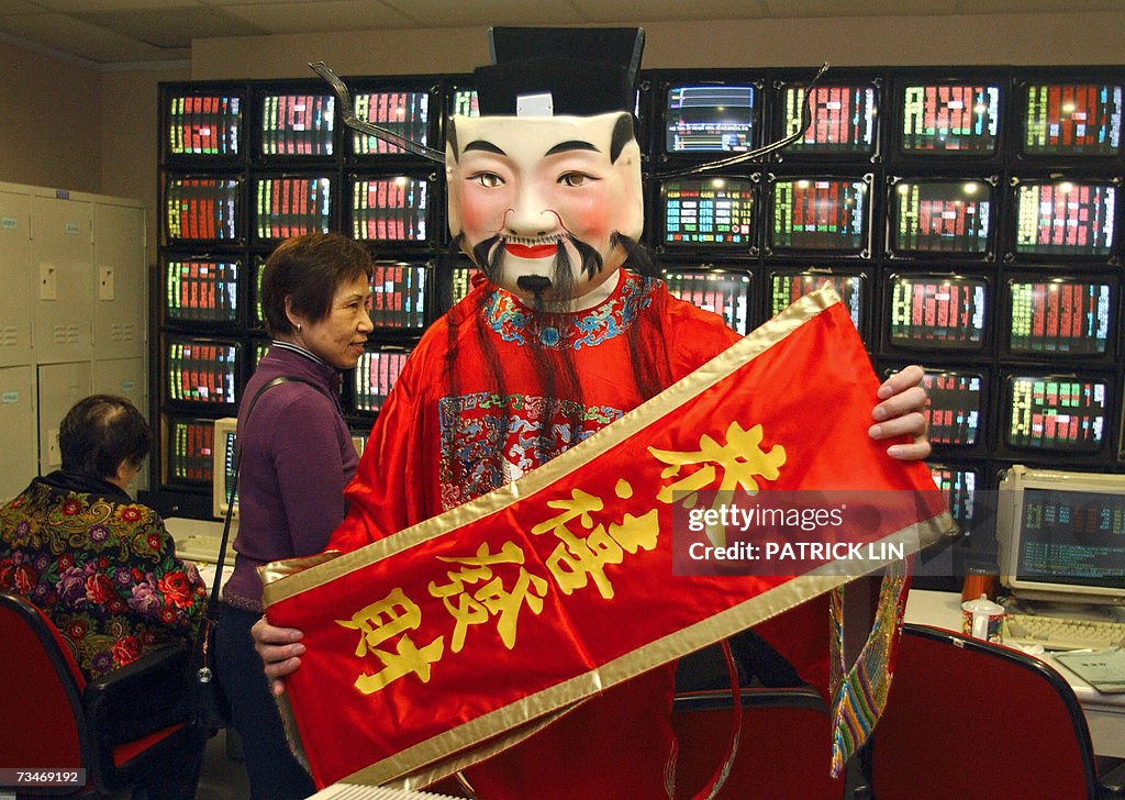 A Taiwanese man wearing a "god of fortun...