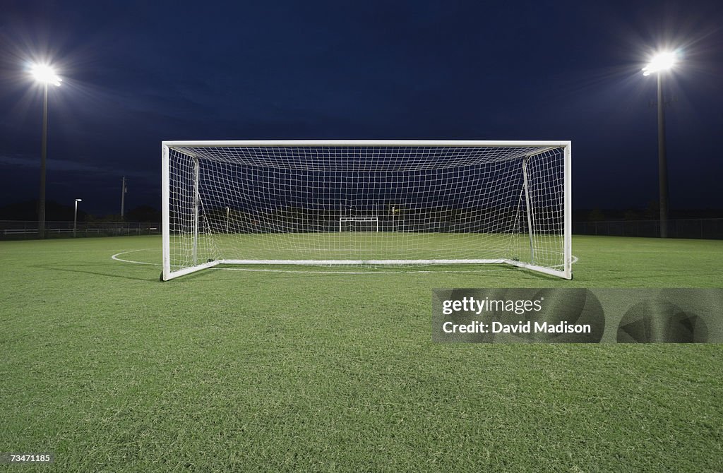 Soccer goal on field at night