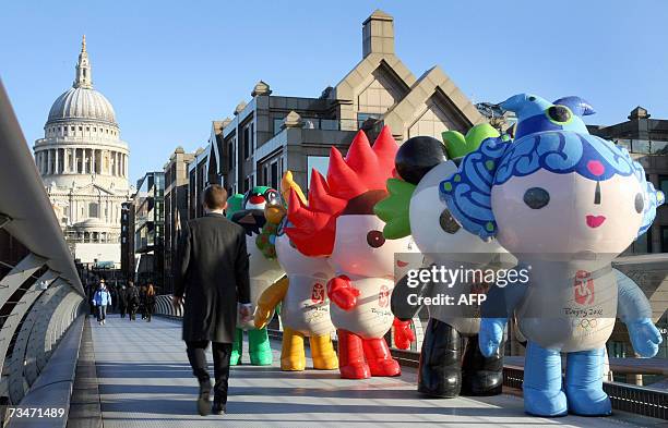 United Kingdom: The Fu Wa, the official mascots of the Beijing 2008 Olympic and Paralympic Games, stand on the Millennium Bridge in London, 02 March...