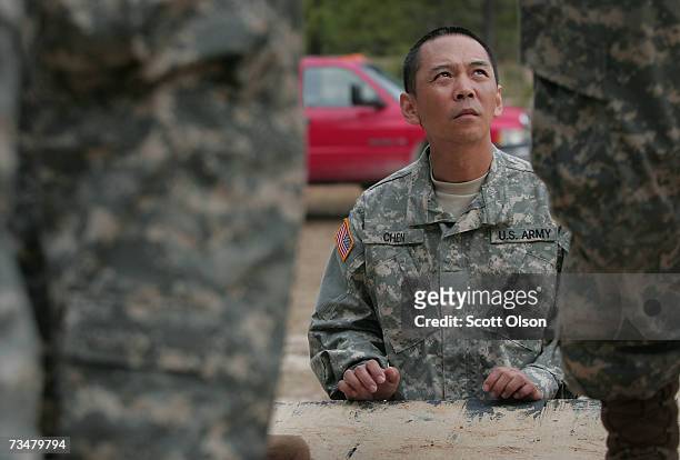Jin Chen of Fremont, California watches fellow soldiers at a teamwork drill during Army basic training at Fort Jackson March 1, 2007 in Columbia,...