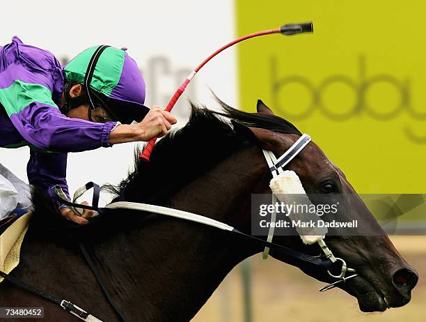 Damien Oliver riding Ambitious General wins the National Jockey Celebration Day Classic during the Futurity Stakes Day at Caulfield March 3, 2007 in...