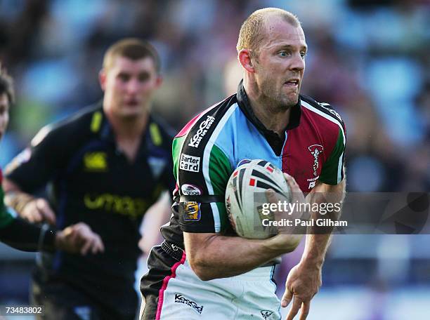 Scott Hill of Harlequins RL breaks through to score a try during the Engage Super League match between Harlequins RL and Warrington Wolves at the...