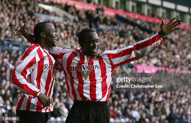 Dwight Yorke of Sunderland celebrates scoring their first goal with Stern John during the Coca-Cola Championship match between West Bromwich Albion...