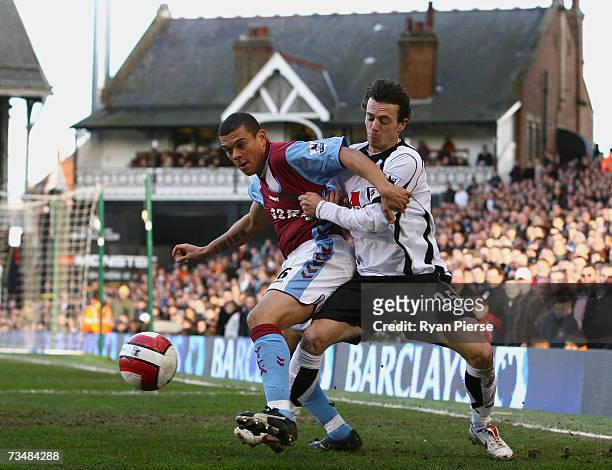 Wilfred Bouma of Aston Villa competes for the ball against Simon Davies of Fulham during the Barclays Premiership match between Fulham and Aston...