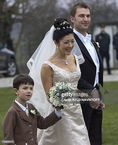 Former Danish Princess Alexandra with her son Prince Nikolai and photographer Martin Jorgensen after their wedding at Oester Egede Church, 03 March...