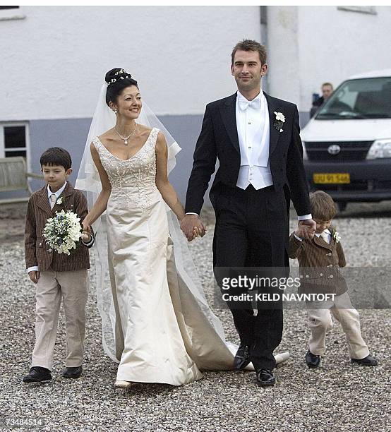 Former Danish Princess Alexandra with her sons Prince Nikolai , Prince Felix and photographer Martin Jorgensen after their wedding at Oester Egede...