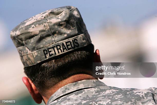 General David Petraeus wears his soft cap while on a visit to Joint Security Station al-Karada after a foot patrol to meet shopkeepers and other...