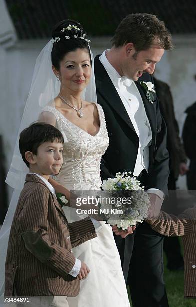 Princess Alexandra of Denmark, Prince Nicolai and her husband Martin Jorgensen pose for photographers after their wedding ceremony at Oster Egende...