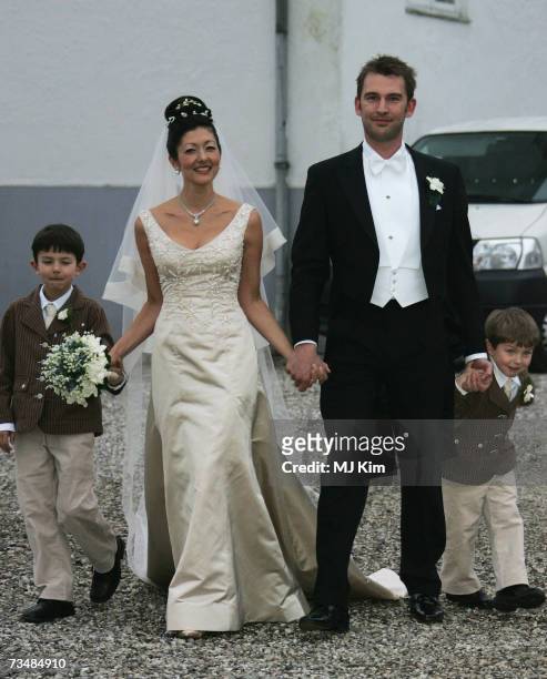Princess Alexandra of Denmark, her husband Martin Jorgensen and her children Prince Nicolai and Prince Felix pose after the wedding ceremony at Oster...