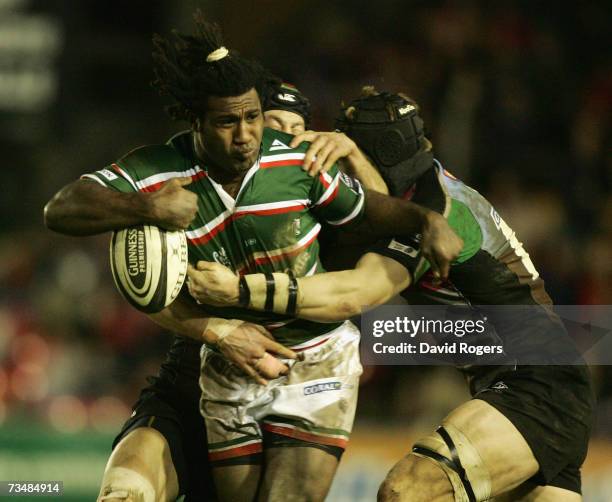 Seru Rabeni of Leicester is tackled by Hal Luscombe and Jim Evans during the Guinness Premiership match between Leicester Tigers and NEC Harlequins...