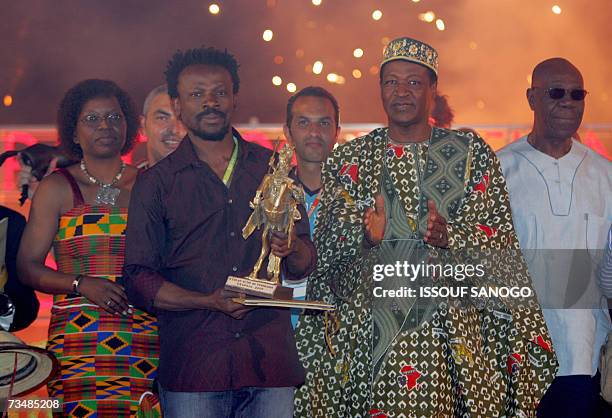 Ouagadougou, BURKINA FASO: Burkina Fasoi Minister of Culture, Arts and Tourism Aline Koala, Nigerian director Newton Aduaka, Burkina Faso President...