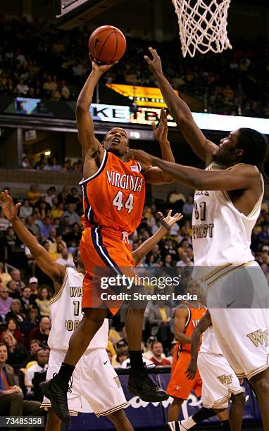 Sean Singletary of the Virginia Cavaliers shoots the ball over Jamie Skeen of the Wake Forest Demon Deacons on March 3, 2007 at Lawrence Joel...