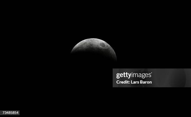 Lunar eclipse sits in the night?s sky on March 3, 2007 in Dinslaken, Germany. The eclipse began at 2018 GMT, with the Moon totally immersed in the...