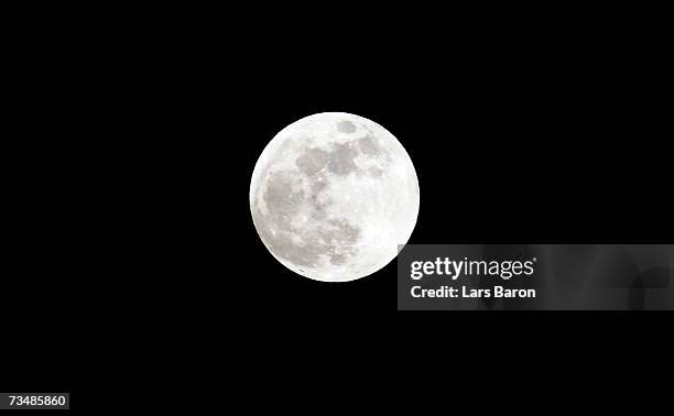 Full moon sits in the nights sky prior to the total lunar eclipse on March 3, 2007 in Dinslaken, Germany. The eclipse began at 2018 GMT, with the...