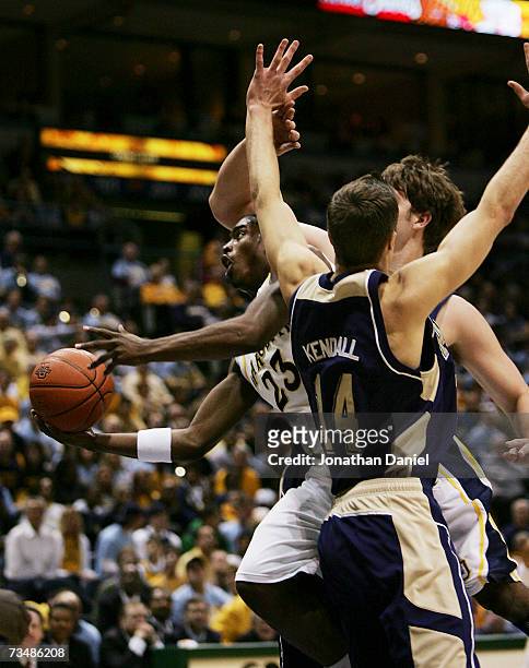 Wesley Matthews of the Marquette Golden Eagles puts up a shot between Levon Kendall and Aaron Gray of the Pittsburgh Panthers on March 3, 2007 at the...
