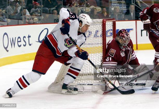 Curtis Joseph of the Phoenix Coyotes defends the net from Fredrik Modin of the Columbus Blue Jackets on March 3, 2007 at the Jobing.com Arena in...