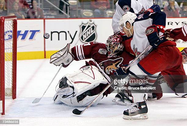 Goaltender Curtis Joseph of the Phoenix Coyotes deflects a third period shot from Gilbert Brule of the Columbus Blue Jackets on March 3, 2007 at the...