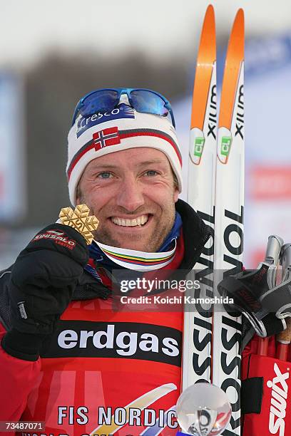 Odd-Bjoern Hjelmeset of Norway poses with his Gold Medal, won in the Mens Cross Country Skiing 50km classical Mass Start Final, during the FIS Nordic...