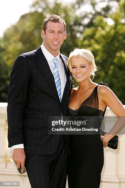 Swimmer Grant Hackett and partner Candice Alley attend the L'Oreal Melbourne Fashion Festival opening party at Government House on March 4, 2007 in...