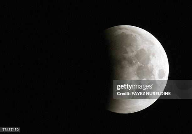 The moon shadowed by the Earth is seen during a eclipse 04 March 2007 in Algiers. Total lunar eclipses occur when the Sun, the Earth and the Moon are...