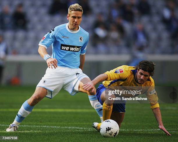 Torben Hofmann of 1860 Munich challenges Patrick Bick of Braunschweig during the Second Bundesliga match between 1860 Munich and Eintracht...