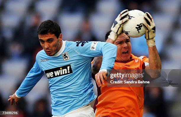 Berkant Goektan of 1860 Munich and goalkeeper Thorsten Stuckmann of Braunschweig in action during the Second Bundesliga match between 1860 Munich and...