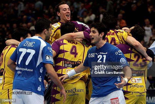 Vedran Zrnic and Alexandros Alvanos of Gummersbach look dejected next to the players of Valladolid after loosing the Champions League quarter final...