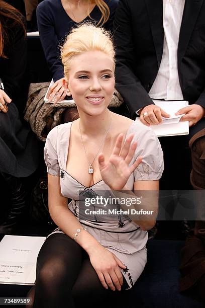 Scarlett Johansson attends the Louis Vuitton fashion show during Paris fashion week Fall/Winter 2008 at Cour carre du Louvre on March 4, 2007 in...