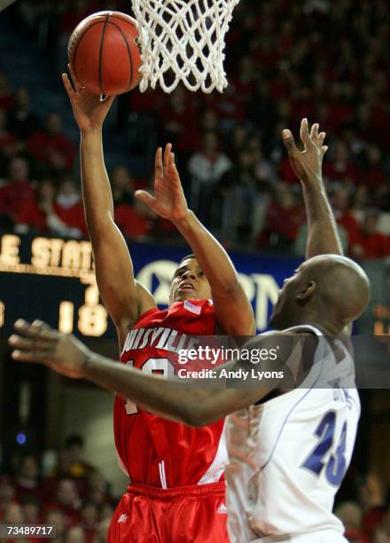 Edgar Sosa of the Louisville Cardinals shoots the ball while defended by Stan Gaines of the Seton Hall Pirates in a Big East Conference game on March...