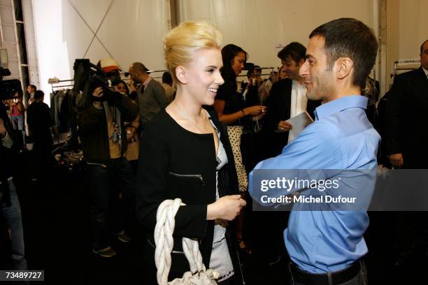 Scarlett Johansson and Marc Jacobs attend the Louis Vuitton fashion show during Paris fashion week Fall/Winter 2008 at Cour carre du Louvre on March...