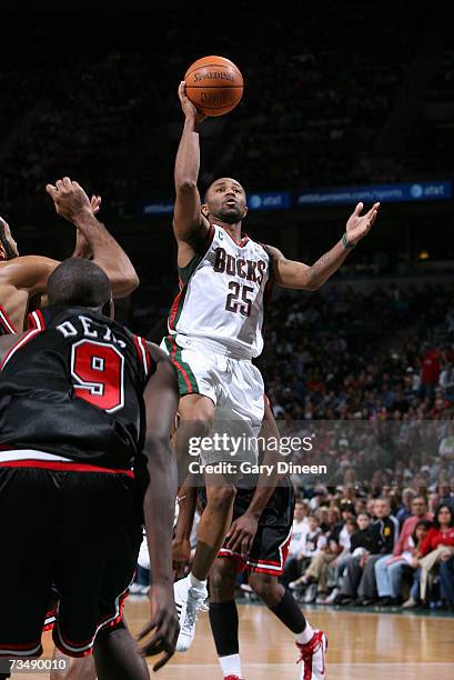 Maurice Williams of the Milwaukee Bucks shoots a layup against Luol Deng of the Chicago Bulls at the Bradley Center March 4, 2007 in Milwaukee,...