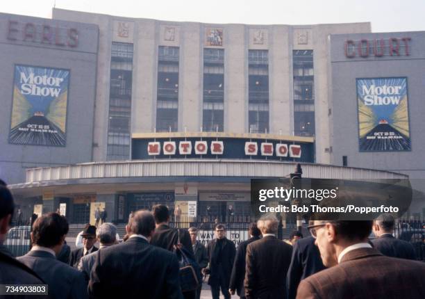 View of visitors and ticket holders crossing Warwick Road to arrive at the 1969 International Motor Show at Earls Court Exhibition Centre in London...