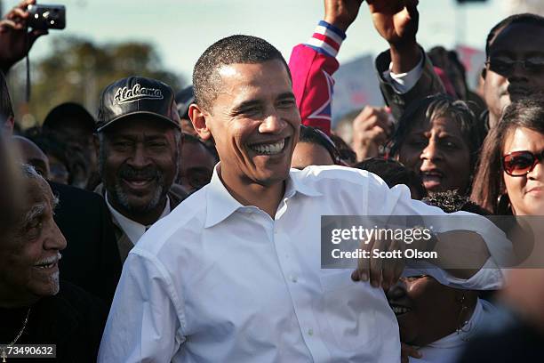 Democratic Presidential candidate Senator Barack Obama marches with a crowd to the Edmund Pettus Bridge to commemorate the 1965 Bloody Sunday Voting...