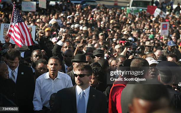 Democratic Presidential candidate Senator Barack Obama marches with a crowd across the Edmund Pettus Bridge to commemorate the 1965 Bloody Sunday...