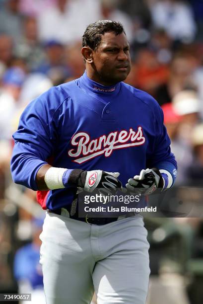 Sammy Sosa of the Texas Rangers walks back to the dugout during the game against the Kansas City Royals at Surprise Stadium on March 4, 2007 in...