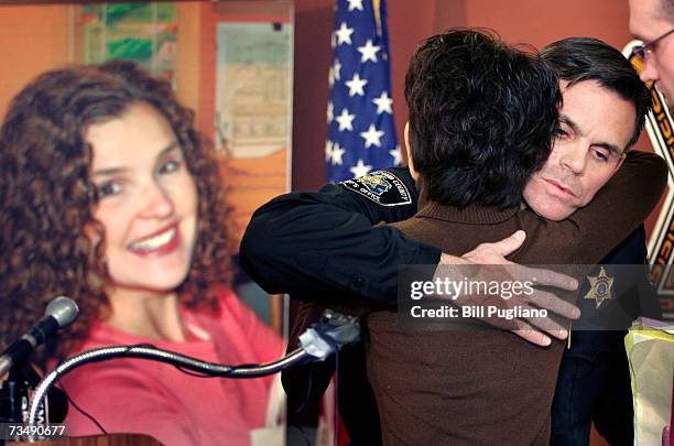 Macomb County Sheriff Mike Hackel hugs Alicia Standefer, the sister of murder victim Tara Lynn Grant , after she read a statement about her sister at...