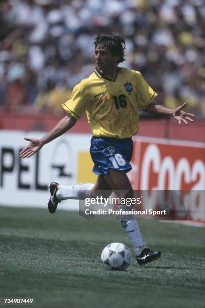 Brazilian footballer Leonardo Araujo pictured making a run with the ball as he appeals for support during play for Brazil in a 1994 FIFA World Cup...