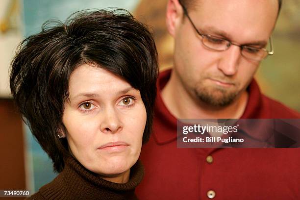 Alicia Standefer, the sister of murder victim Tara Lynn Grant, stands with her husband and delivers a statement about her sister at a media briefing...