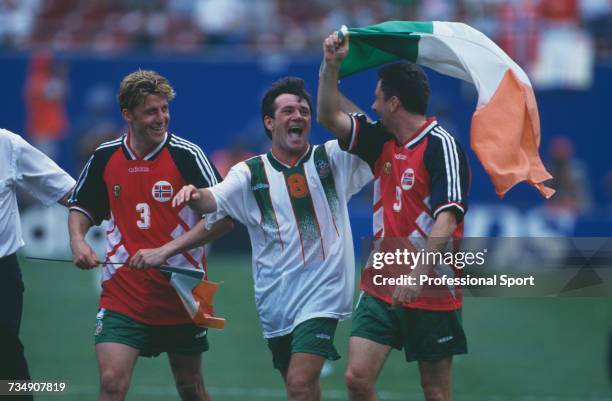 Republic of Ireland footballers, from left, Andy Townsend, Ray Houghton and John Aldridge celebrate after the Republic of Ireland drew 0-0 with...