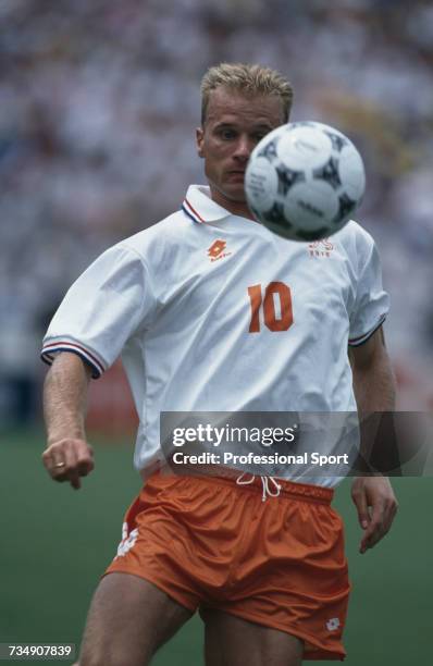 Dutch footballer Dennis Bergkamp pictured with the ball during play in the 1994 FIFA World Cup quarter-final match between Netherlands and Brazil at...