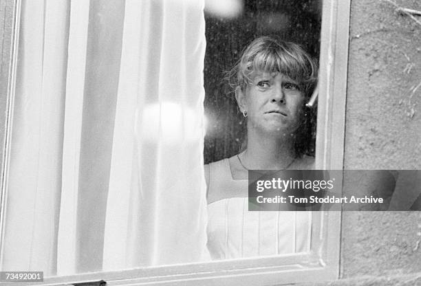 English tennis player Sue Barker looking out of a centre court window after her final appearance at the Wimbledon tennis tournament, June 1984.