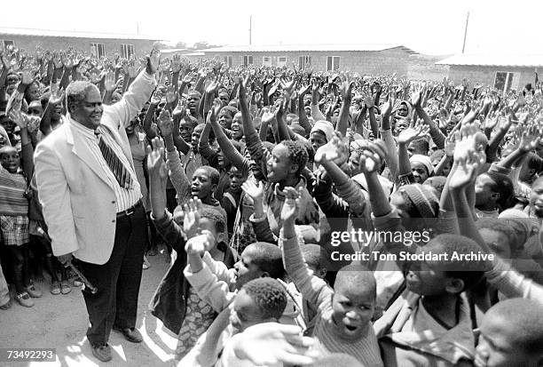 Zimbabwean nationalist leader and founder of the Zimbabwe African People's Union , Joshua Nkomo with a group of supporters, Harare, April 1980.