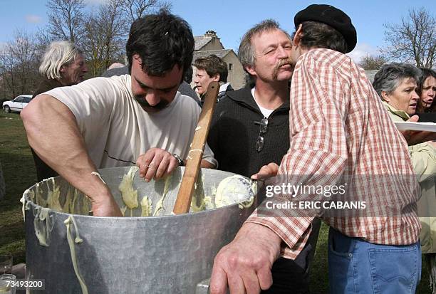 French farmer-activist and candidate for the 2007 presidential election Jose Bove welcomes farmers who prepare a local cheese and potatoes culinary...