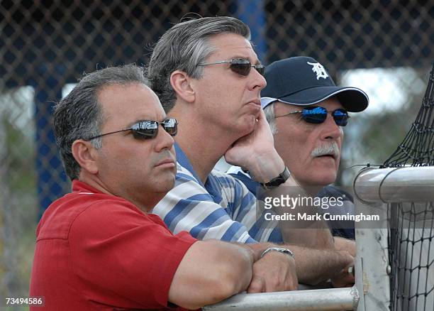 Detroit Tigers Assistant General Manager Al Avila, President Dave Dombrowski and manager Jim Leyland watch batting practice during Spring Training...