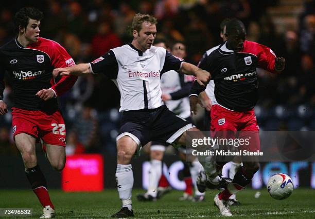 Bradley Wright Phillips of Southampton is tracked by Liam Chilvers during the Coca-Cola Championship match between Preston North End and Southampton...