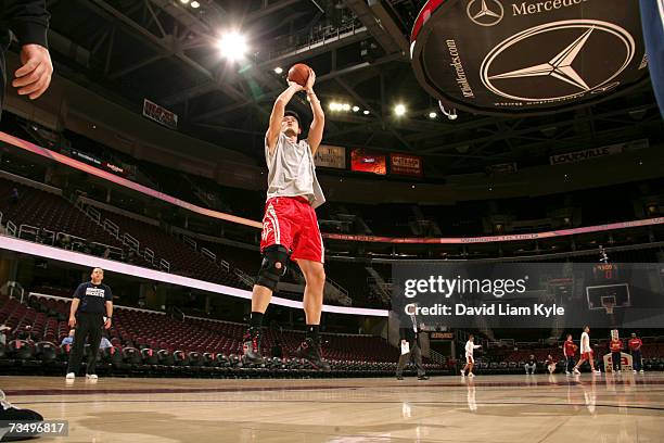 Trainers clear the court so that Yao Ming of the Houston Rockets has plenty of time to warm up for the game against the Cleveland Cavaliers at The...