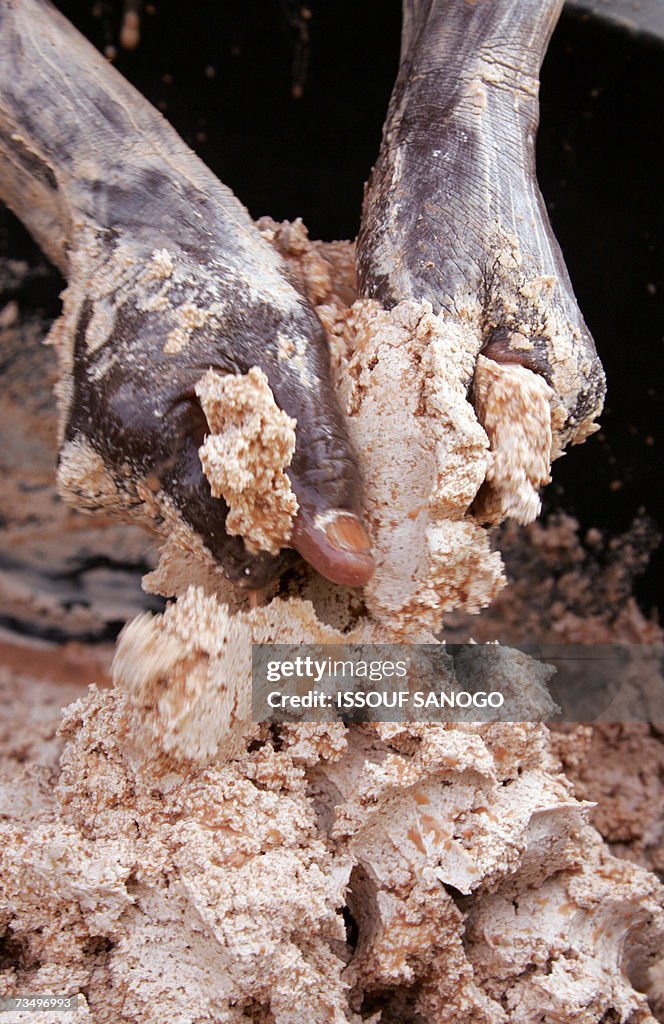 A woman from a cooperative prepares shea...